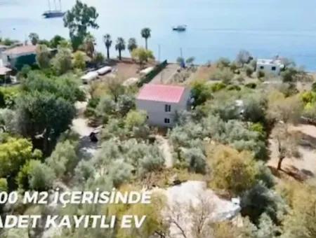 Marmaris Söğüt Mahallesi Denize Sıfır 2000M2 Arsa Satılık Müstakil Ev.önüne Tekne Bağlamaya Uygun.